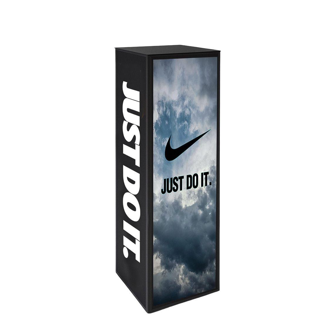 Fully branded black acrylic plinth featuring a bold ‘Just Do It’ design with the Nike logo and sky imagery, showcasing premium custom printing across all visible sides for retail and event display use.