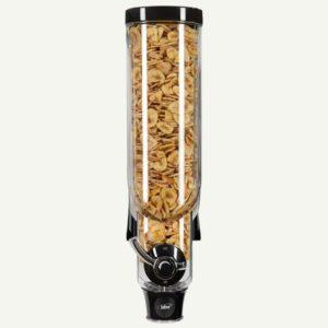 A front facing view of a bulk dry food dispenser with dried banana chips inside.