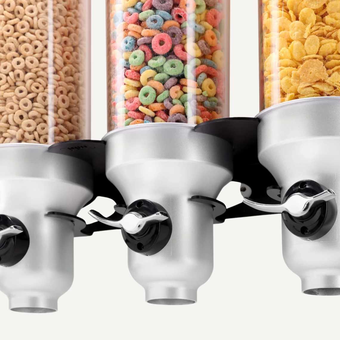 A close up of a black and silver, three cylinder, wall mounted cereal dispenser with different cereals inside.
