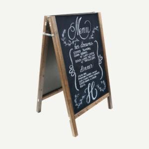 An A-Board chalkboard with a straight top with hand drawn specials menu in white chalk.