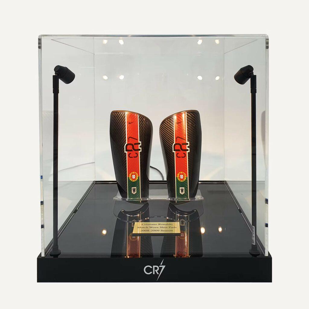 Cristiano Ronaldo’s match-worn shin pads from the 2008-2009 season in a custom display case with lighting.