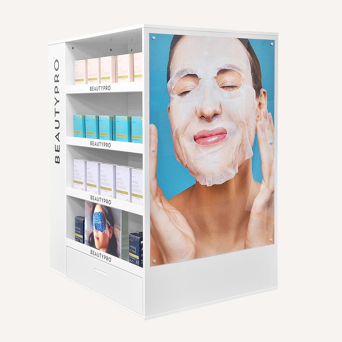 White branded floor standing display unit with beauty pro beauty products on display. Featuring four shelves, a storage draw at the bottom and digitally printed graphics.