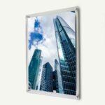A clear acrylic frame with a skyscraper print inside.