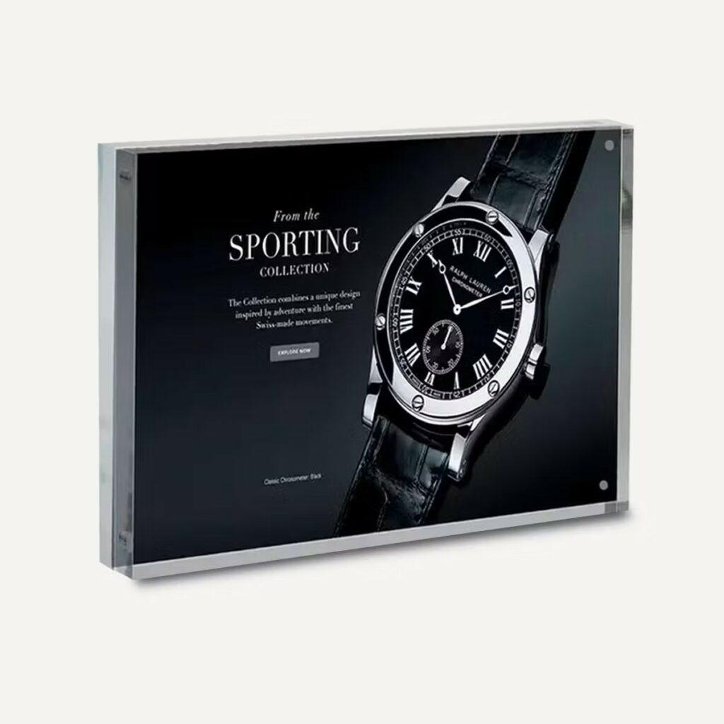 A framed photo block advertising a watch.