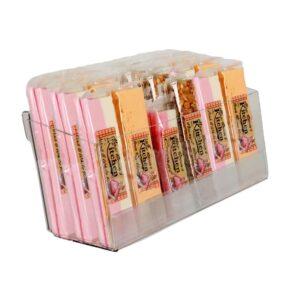 An acrylic parasite display holding bars of nougat.