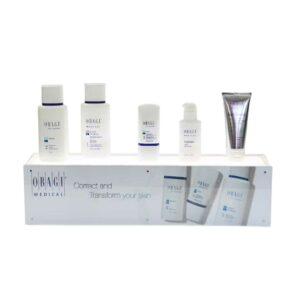 A custom, illuminated countertop display holding different skincare products.