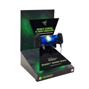 A tabletop product glorifier featuring Kishi's gaming console on a stand.