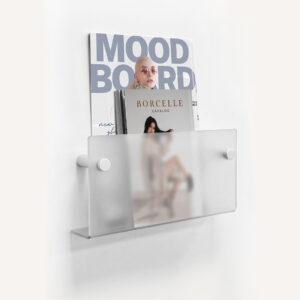 Opal Frosted Acrylic Shelf with fashion magazines on display.