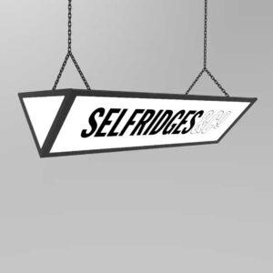 A long triangular ceiling mounted "selfridges" lightbox.