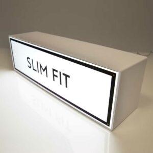 A rectangular lightbox with "slim fit" text.
