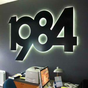 Illuminated "1984" sign.