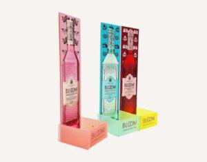 A custom acrylic bottle glorifier with one of the sections parted.