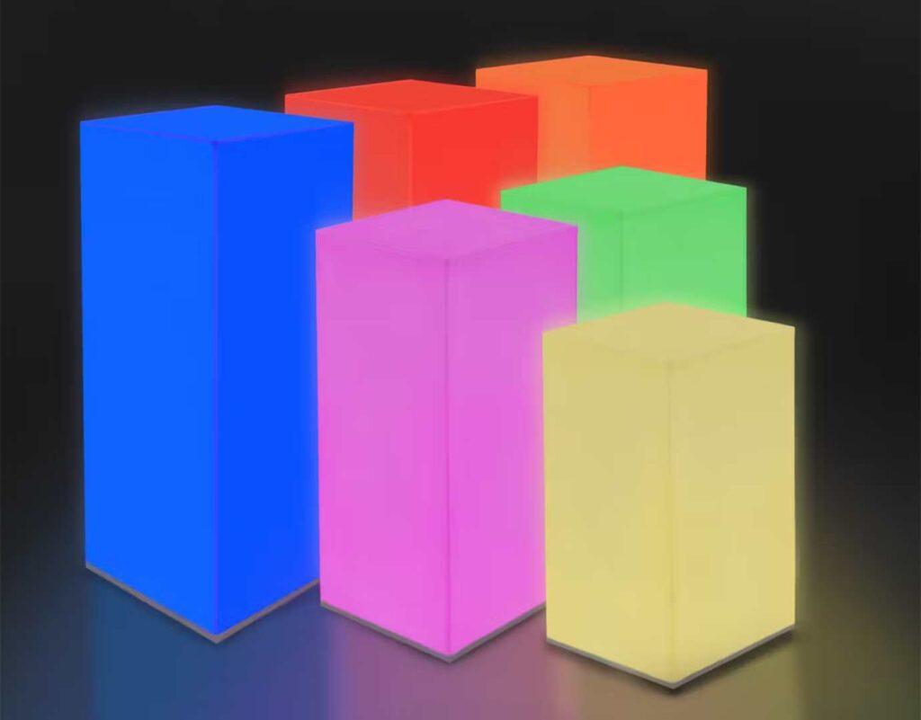 Some illuminated display plinths in different colours and sizes.