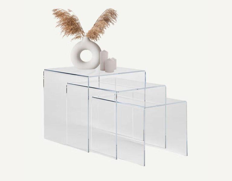 A nest of clear acrylic tables.