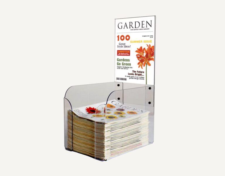 A countertop magazine dump bin with interchangeable graphics header pocket.