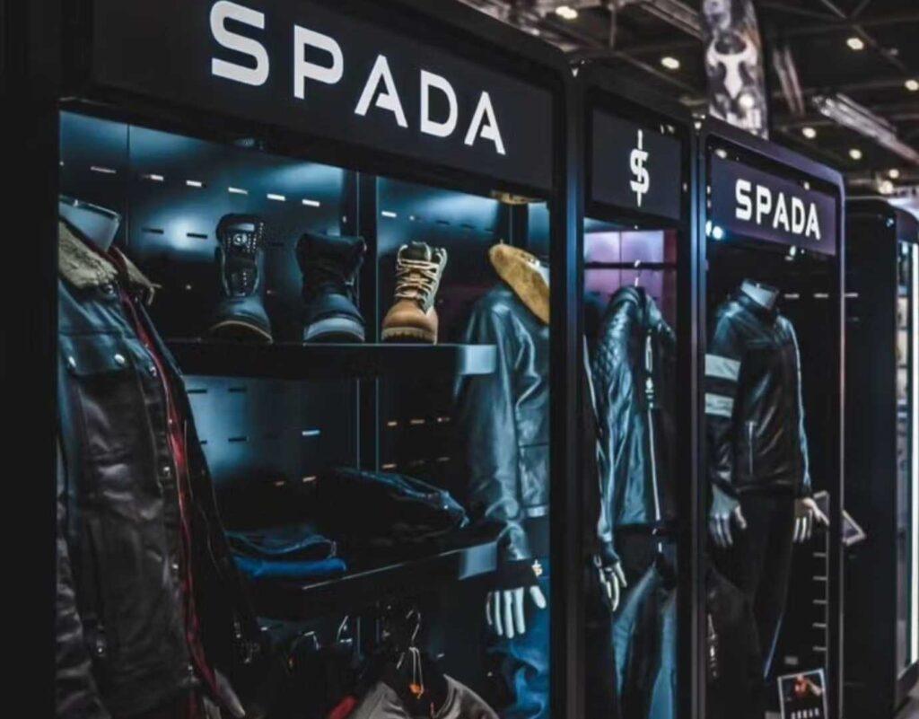 A custom exhibition display for spada, with clothing on display.