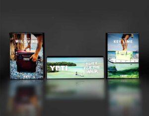A set of three front facing illuminated lightboxes.