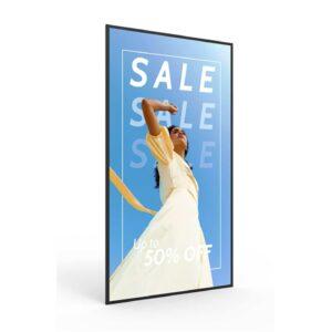 A 4K professional monitor display with a sale advertisement on the screen.