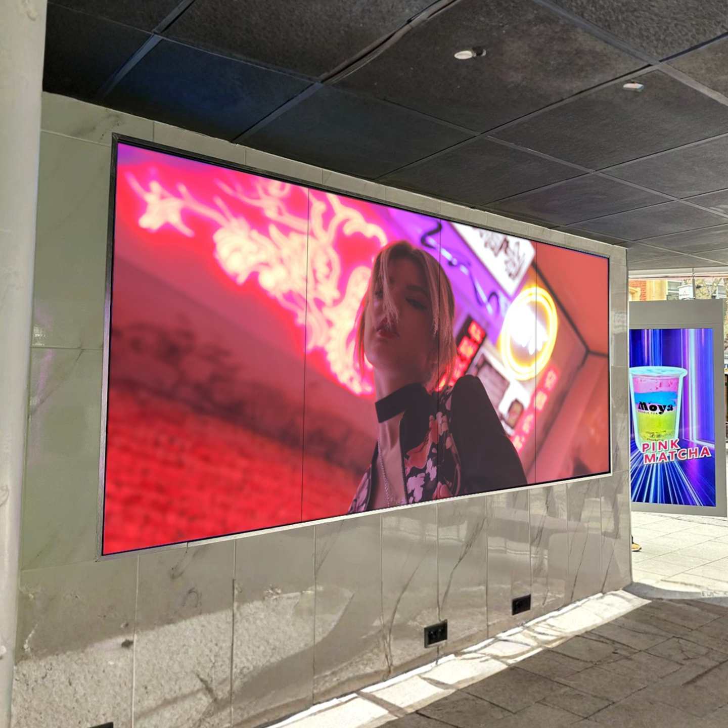 An ultra narrow bezel LCD video wall display on a wall.