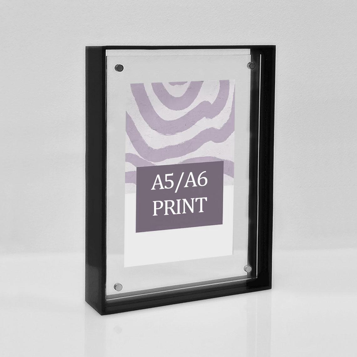 A solid black picture frame for A5/A6 prints.