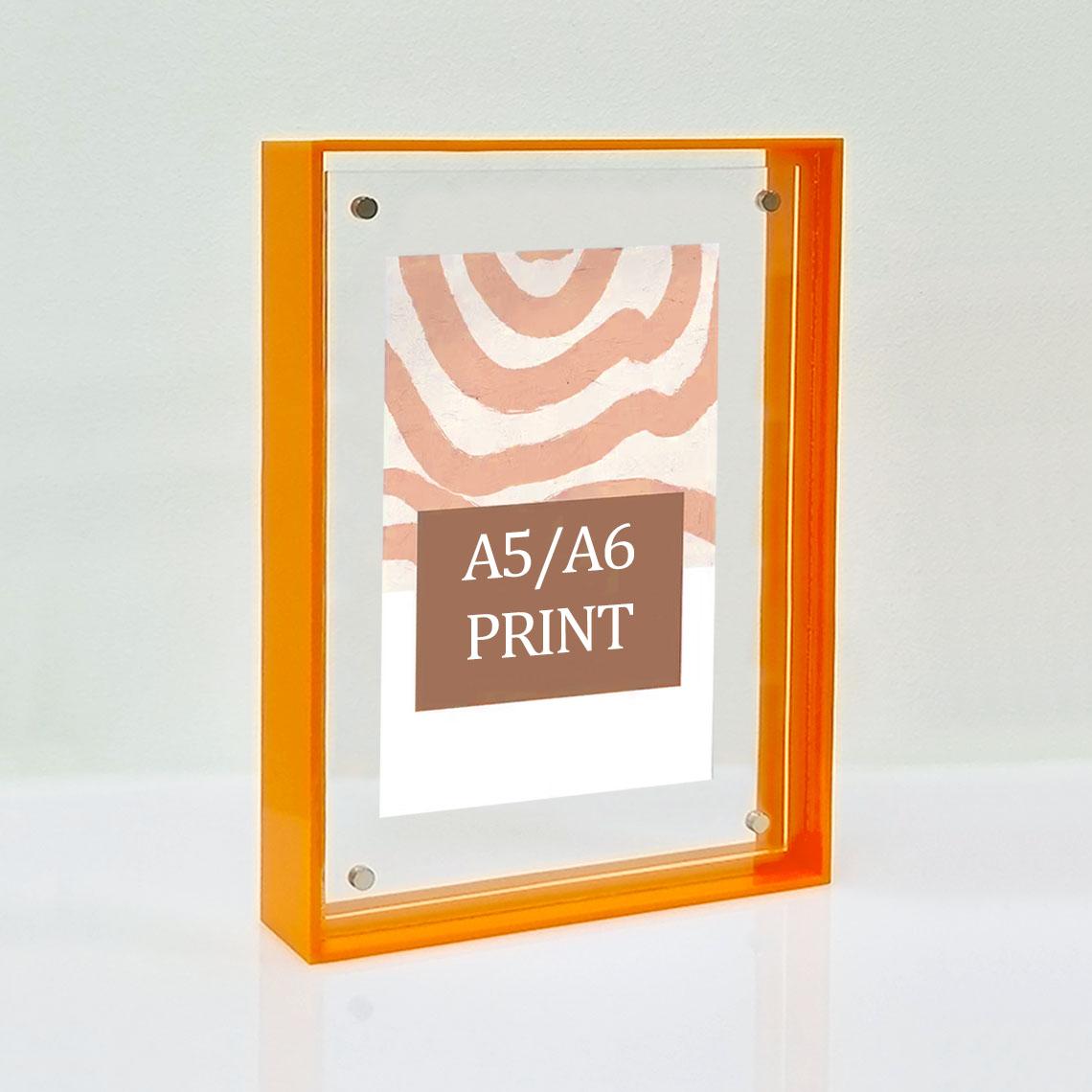 A solid orange picture frame for A5/A6 prints.