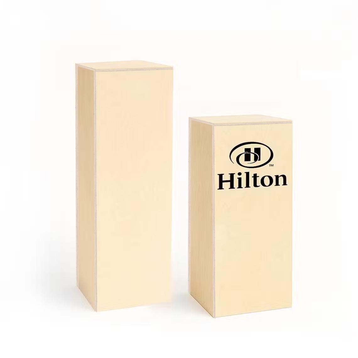Two birch plywood plinths in different heights with custom branding.