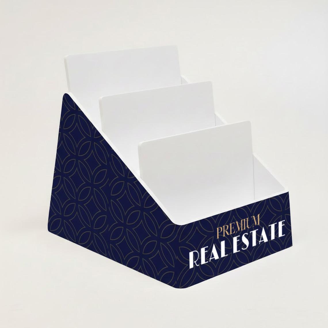 Custom branded deep blue acrylic business card display holder featuring multiple stepped compartments for displaying business cards.