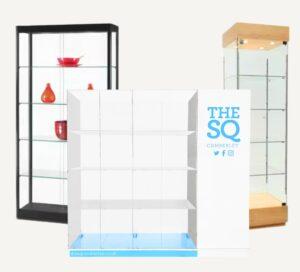 Glass, acrylic, wooden-framed and metal-framed display cabinets, including a frameless acrylic storage cabinet branded for The SQ Camberley.