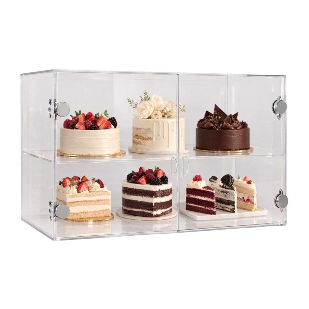 An acrylic display cabinet with cakes on display.