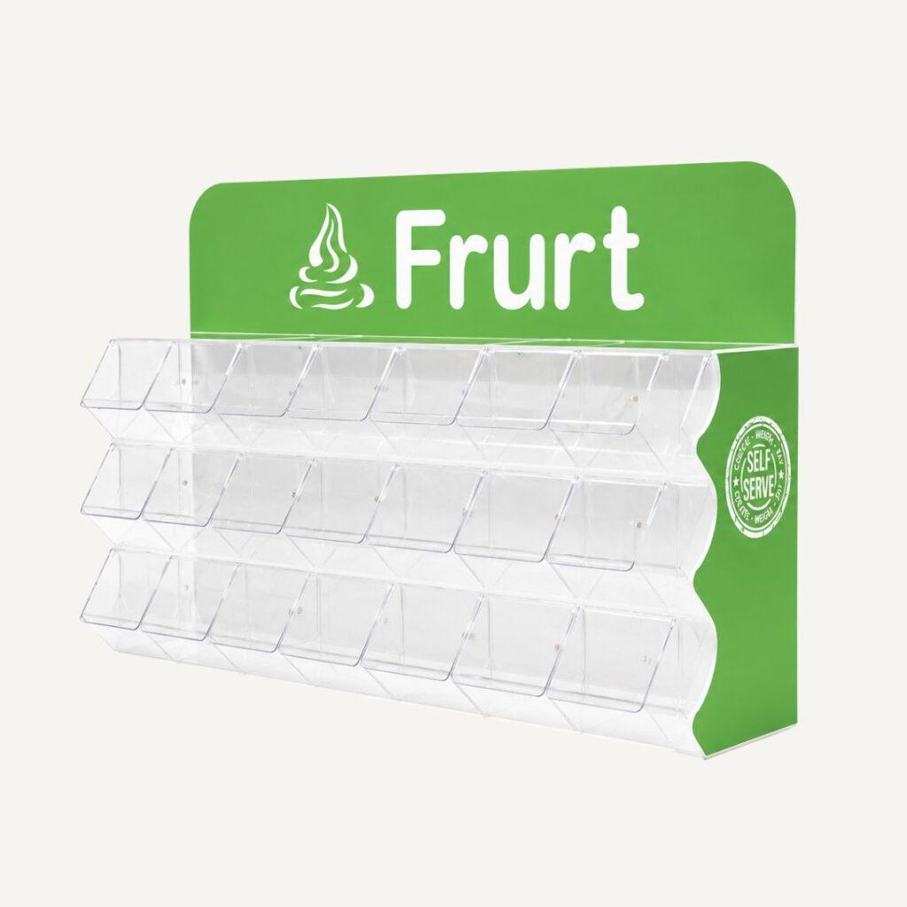 Modern countertop self-serve toppings display with clear compartments and branded green header for retail environments.