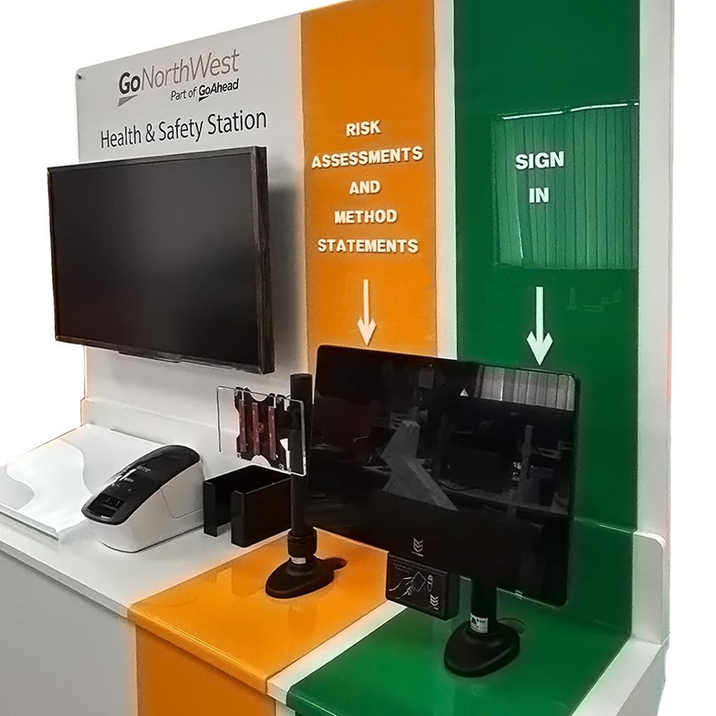 Health and safety station detail showing risk assessment signage, tablet mount and digital display system
