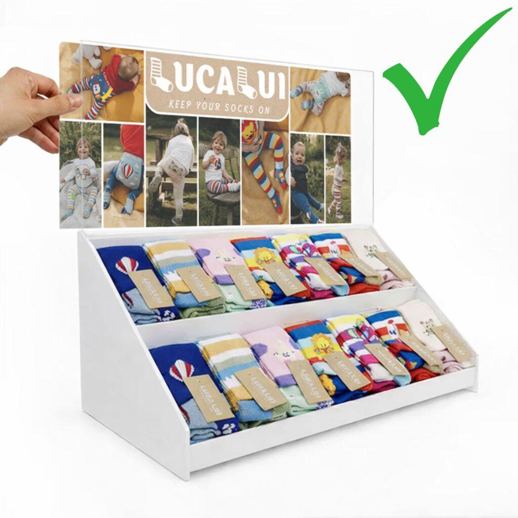 A countertop pos display with a graphics trap and a green tick in the righthand corner.