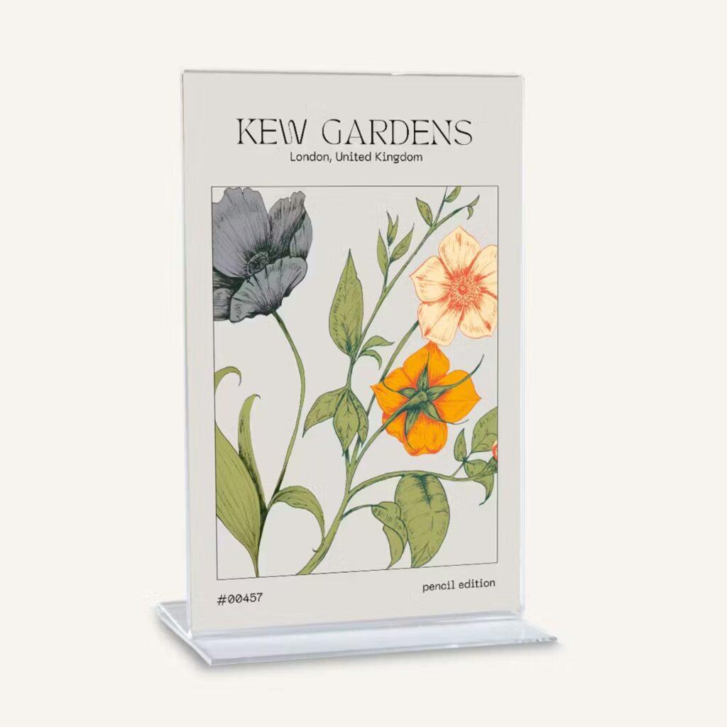 A freestanding, countertop menu holder made from clear acrylic with Kew Gardens branding on display.