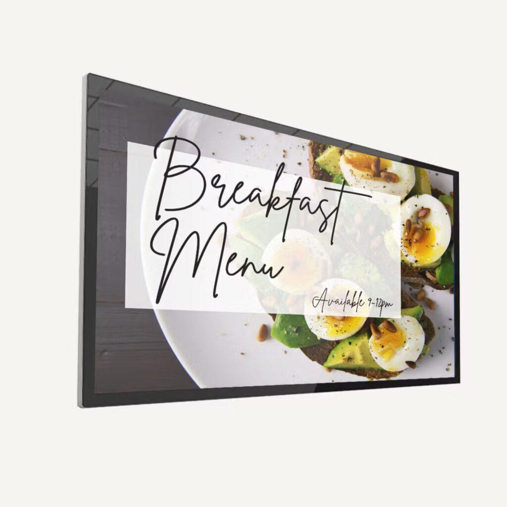 Digital screen with a breakfast menu text on the screen.