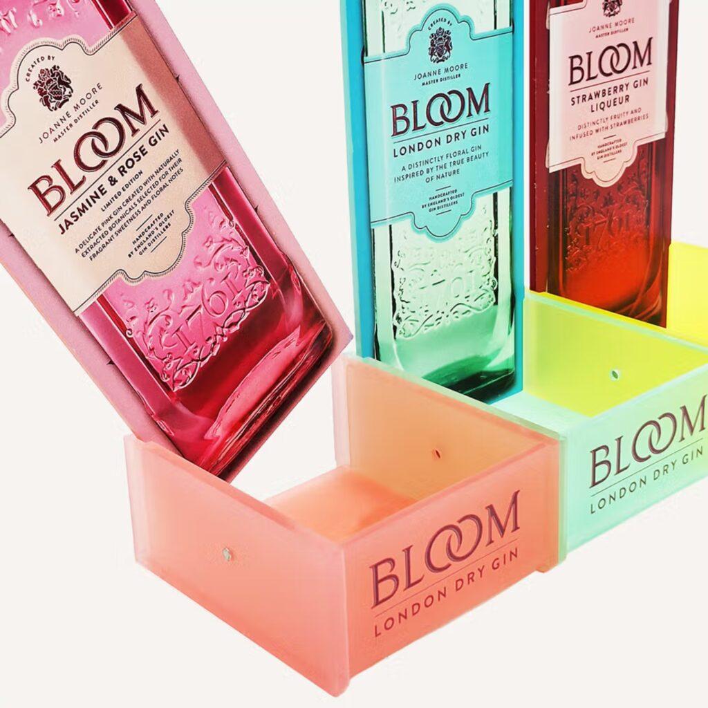 A custom acrylic bottle glorifier display with magnetic panels.