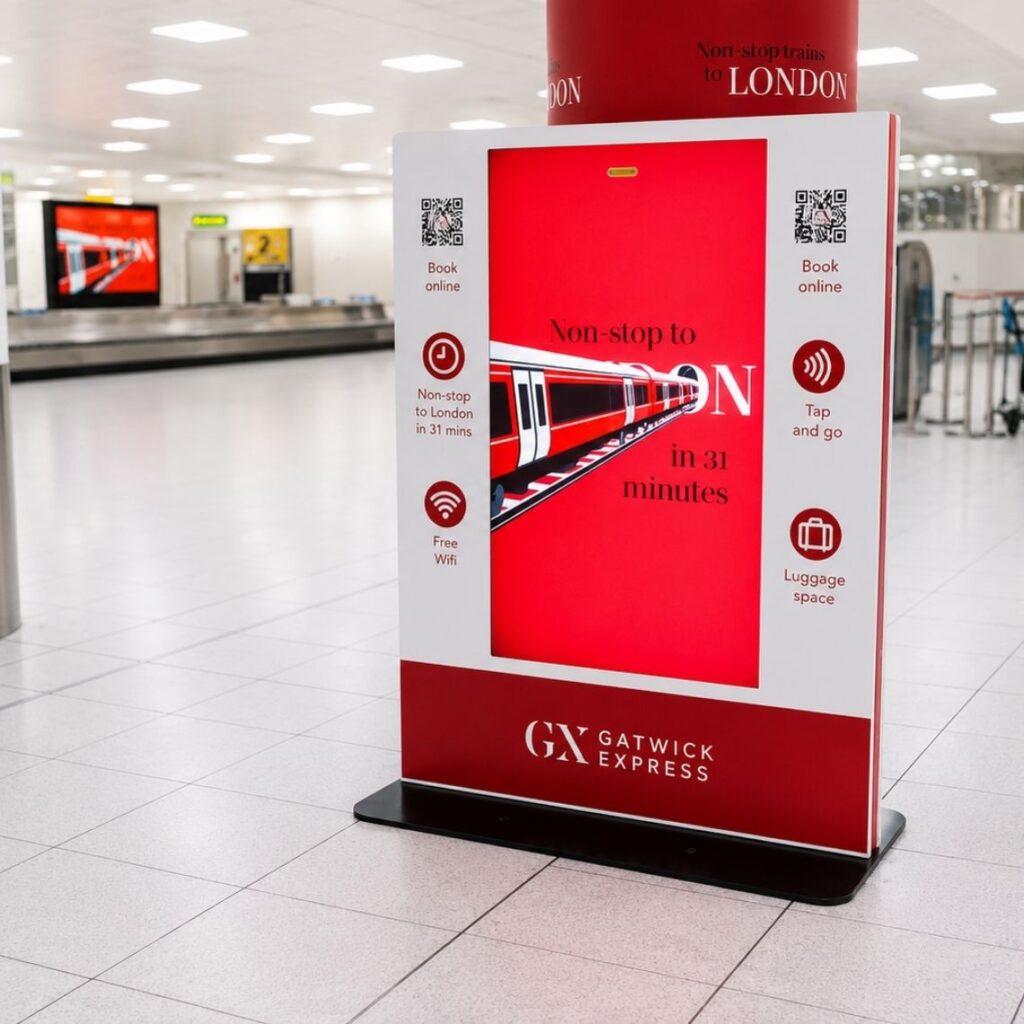 Floor-standing digital advertising display for Gatwick Express at Gatwick Airport.