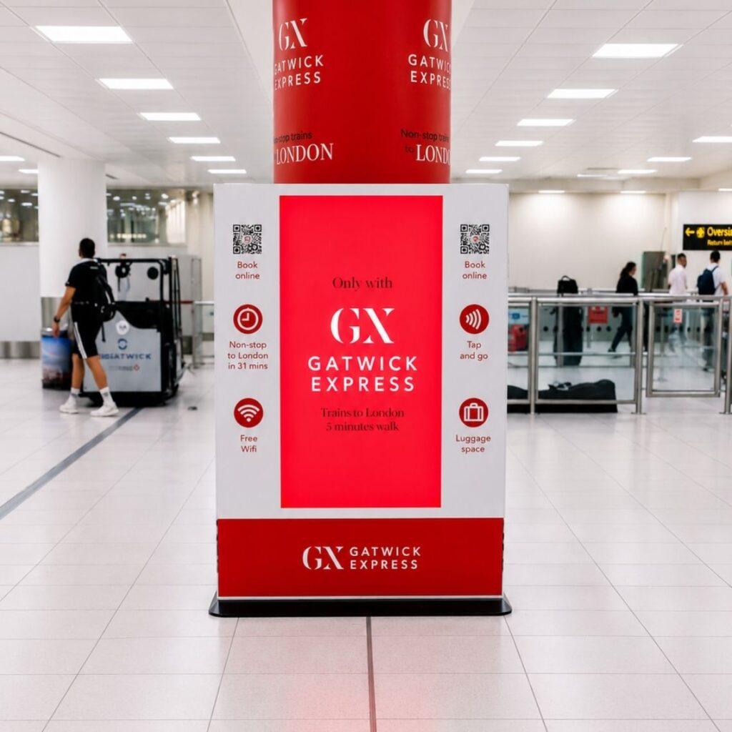 Branded Gatwick Express digital totem display with integrated advertising screen.