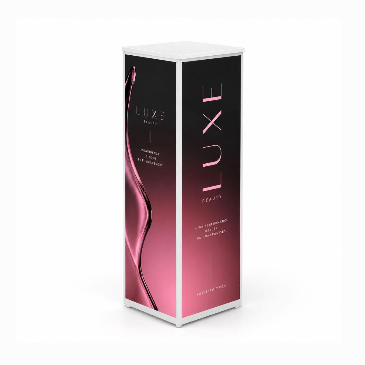 White retail display plinth with branded magnetic graphic panels on multiple sides