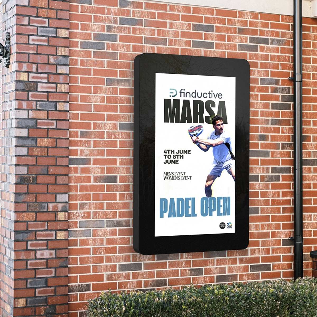 55-inch outdoor wall-mounted digital display showing a padel event advert on a brick building